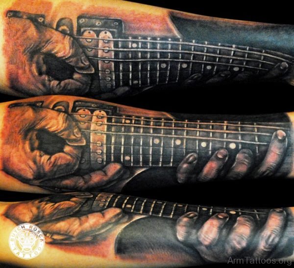 Marvelous Guitar Tattoo On Arm 