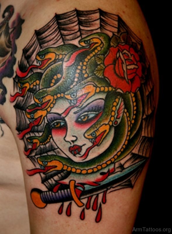 Medusa And Dagger Tattoo On Arm 