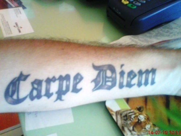 Mind Blowing Carpe Diem Tattoo On Arm 