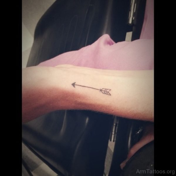 Nice Black Arrow Tattoo On Arm 