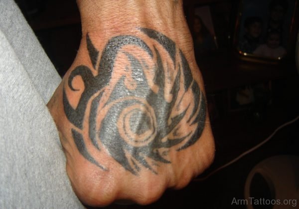 Nice Black Tribal Tattoo On Left Hand