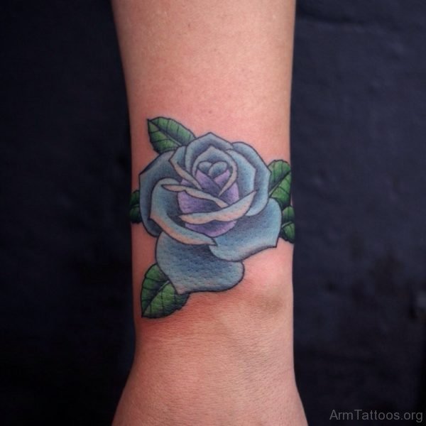 Nice Blue Rose Tattoo On Wrist 