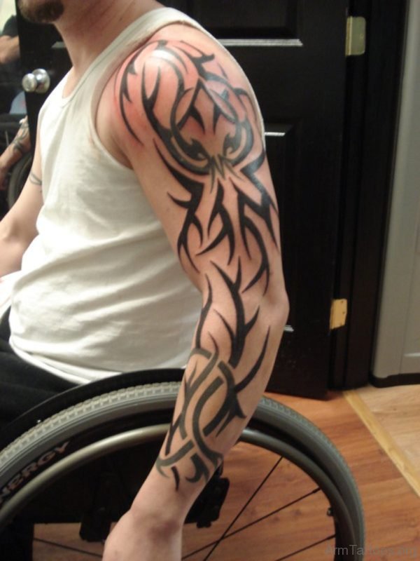 Nice Tribal Design Tattoo On Left Full Sleeve For Men