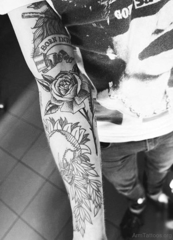 Outstanding Black Rose Tattoo On Arm 