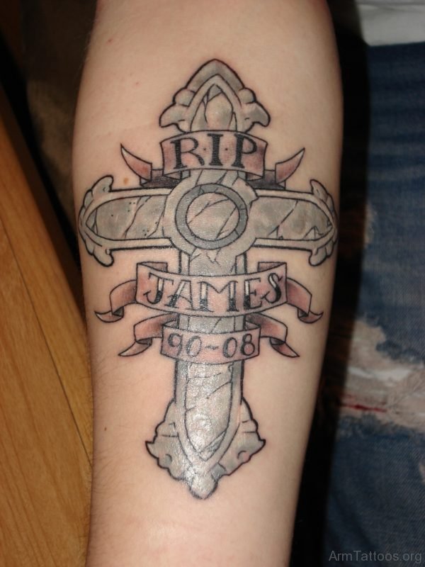Outstanding Memorial Cross Tattoo On Lower Arm