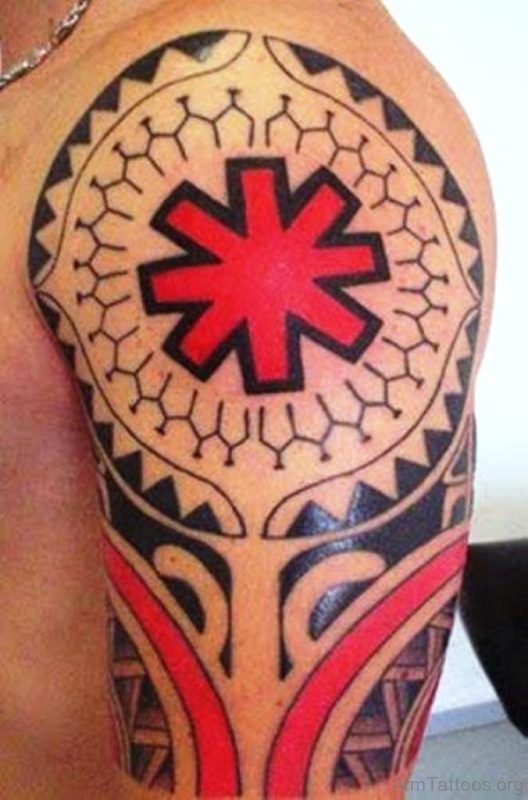 Red Maori Tattoo On Arm 