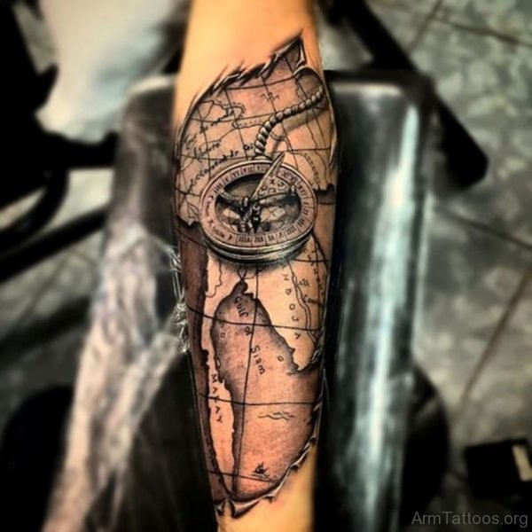 Ripped Skin Map With Compass Tattoo On Forearm