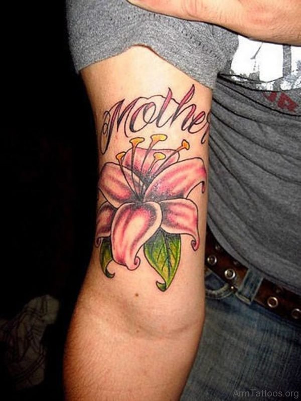 Showing Mother Lily Flower Tattoo On Arm
