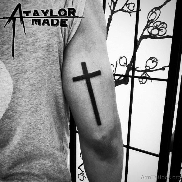 Simple Black Cross Tattoo On Arm 