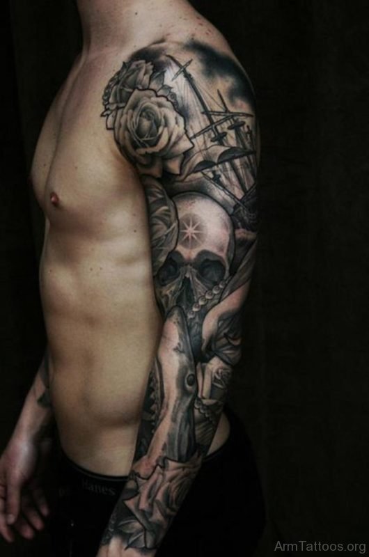 Skull With Tribal Tattoo On Full Sleeve