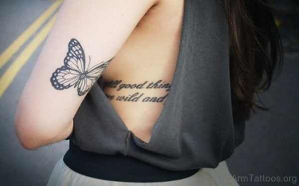 Small Butterfly on Upper Back Arm Tattoo