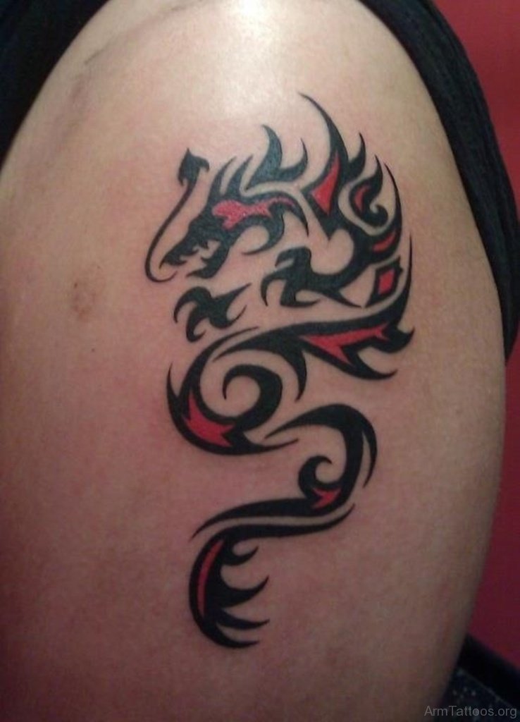 Small Tribal Dragon Tattoo On Shoulder.