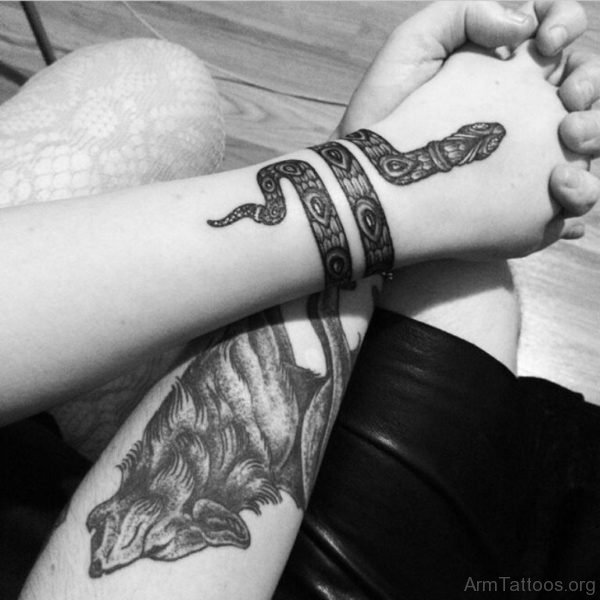 Snake Tattoo Wrapped Around The Wrist 