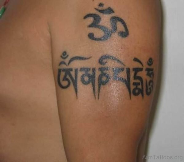 Tibetan Script With Om Tattoo On Left Shoulder