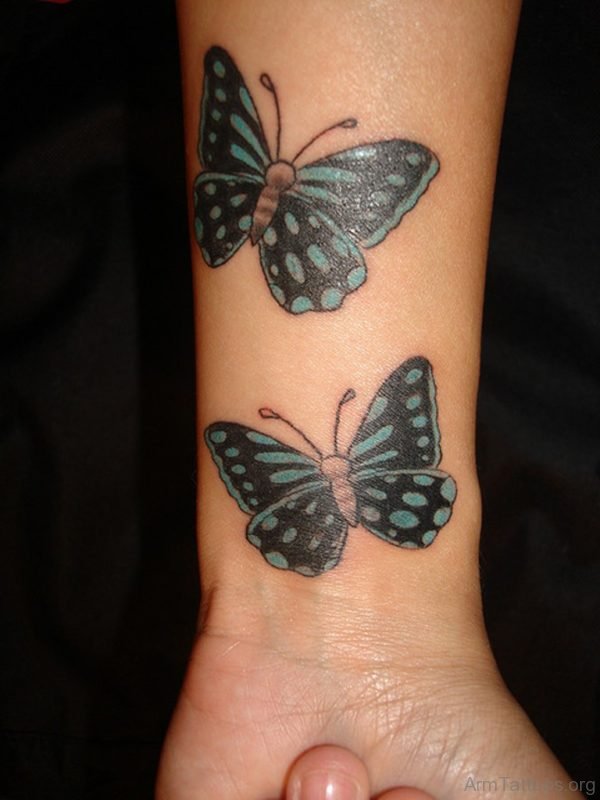 Tiny Butterfly Tattoo On Wrist