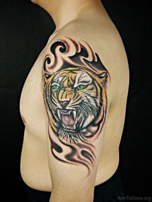 Tribal And Tiger Tattoo On Left Shoulder