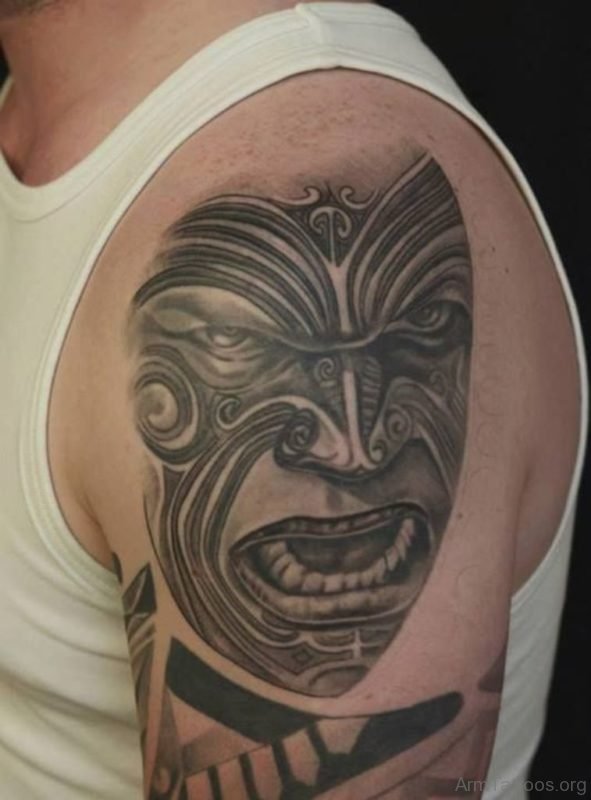 Tribal Black And Grey Mask Tattoo On Arm 