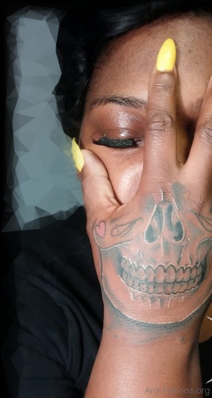 Yellow Nails Skull Tattoo