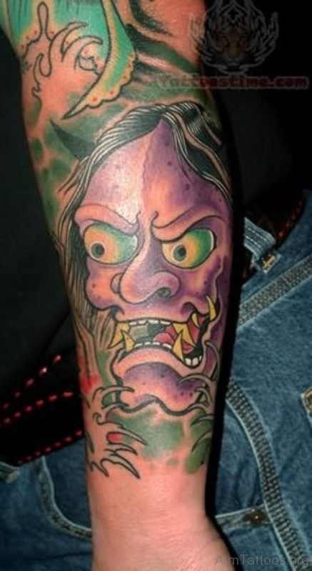 Hannya mask tattoo on arm
