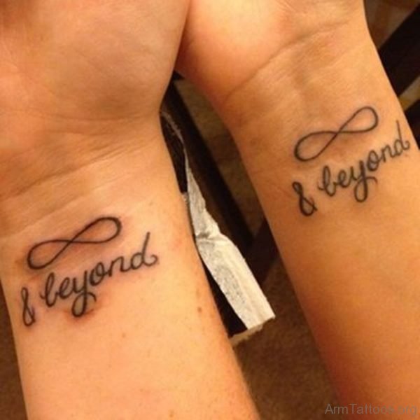 Infinity Beyond Wording Tattoo On Couple Wrist